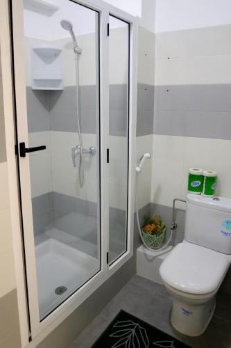 a bathroom with a shower stall and a toilet at Résidence Tafoult Imiouadar près de Taghazout Agadir in Agadir nʼ Aït Sa