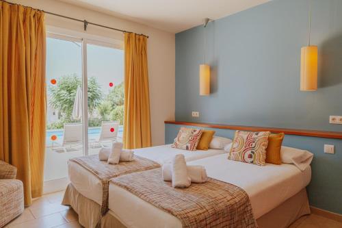 En eller flere senge i et værelse på Villa Santo Tomás - Loli