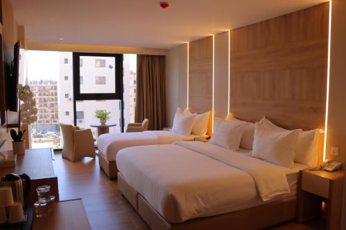 Postel nebo postele na pokoji v ubytování Aysel Hotel