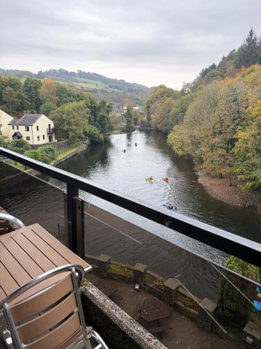 a view of a river with people kayaking in it at Whitewater Hotel & Spa in Newby Bridge