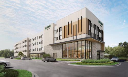 a rendering of a building with cars parked in a parking lot at EVEN Hotel Miami - Doral Area by IHG in Sweetwater