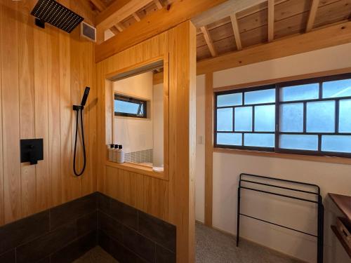 a bathroom with a window and a shower at Yugashira Kuu ゆがしら空 in Imabari