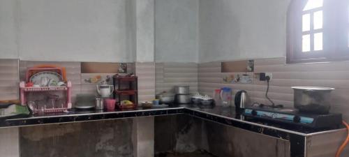 a kitchen with a sink and a counter top at Blessed guest Nuwara eliya in Nikawatawana