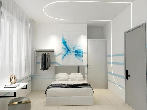 Een bed of bedden in een kamer bij One Stop Hotel Ipoh