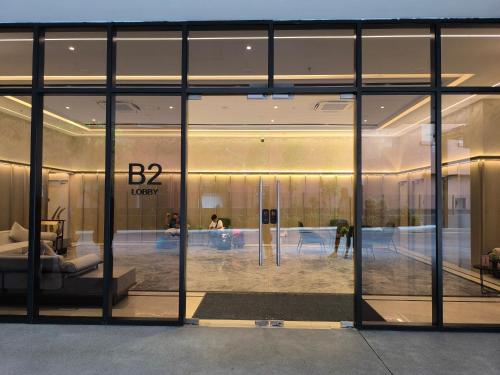 a large glass window of a building with a lobby at Sky View Agile Residence Bukit Bintang KL in Kuala Lumpur