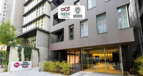 a building with a sign in front of it at Best Western Plus Hotel Fino Osaka Kitahama in Osaka