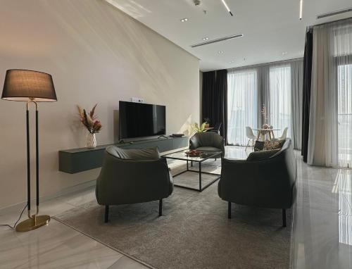 Μια τηλεόραση ή/και κέντρο ψυχαγωγίας στο Tashkent City Downtown Deluxe Host Apartments