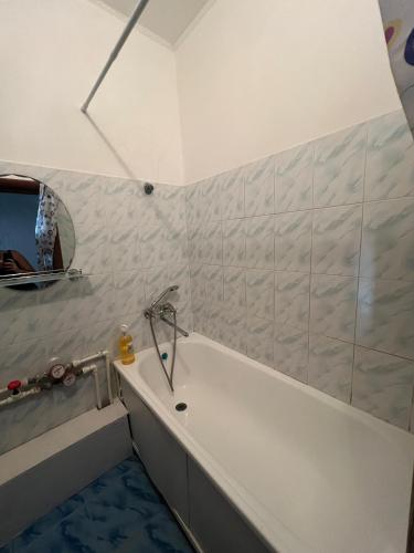 Koupelna v ubytování Трёхкомнатная квартира на Томпиева