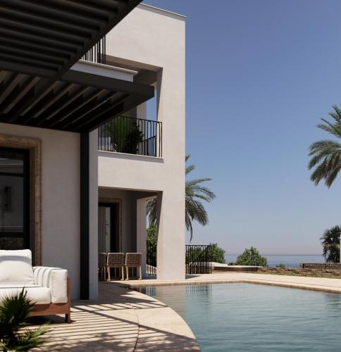 a villa with a swimming pool and a house at Lantana Villas & Hotel in Peyia