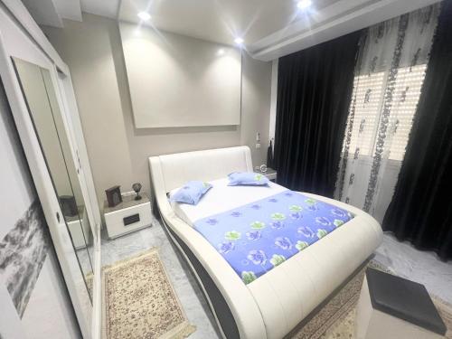 Ένα ή περισσότερα κρεβάτια σε δωμάτιο στο nice apartement