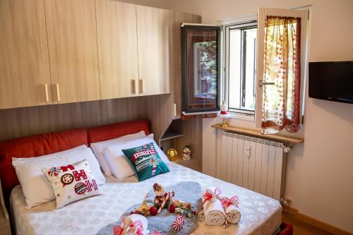 Postel nebo postele na pokoji v ubytování Lo Smeraldo by Ca-Sa Check