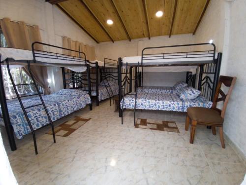 Postel nebo postele na pokoji v ubytování Villa de las Palmas de Rozo Palmira