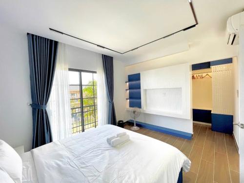 Postel nebo postele na pokoji v ubytování MYSTERY HOME - 180m2 3BEDROOM - NOVAWORLD PHAN THIET