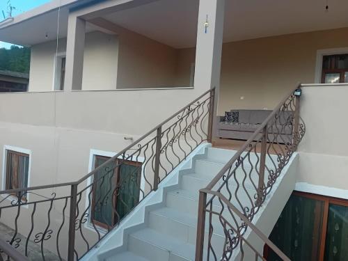 a set of stairs in a house with a mirror at Villa Gimi in Gjirokastër