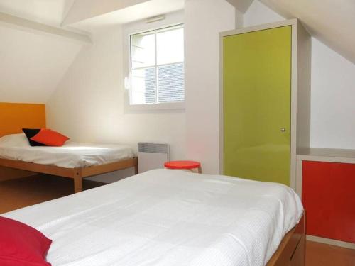 Postel nebo postele na pokoji v ubytování VVF Camping Les Dunes Créances - Plage du Cotentin