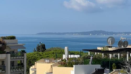 a view of the ocean from a building at Le Lido - Piscine, proche plage in Cros-de-Cagnes