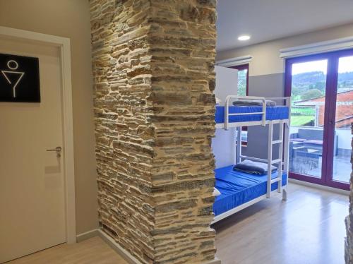 Postel nebo postele na pokoji v ubytování Albergue Goas