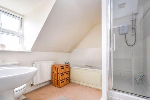 a bathroom with a sink toilet and a shower at Your 4 Bedroom Townhouse - Superking Bed in Stamford
