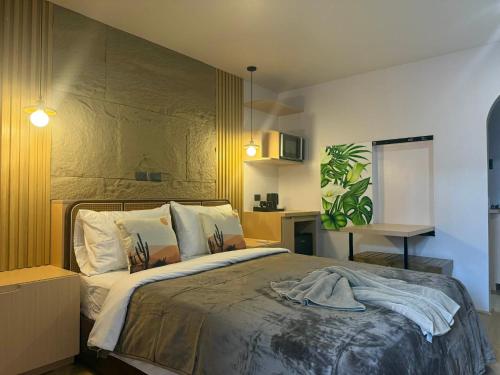 a bedroom with a large bed in a room at Inngo Tourist Inn in El Nido