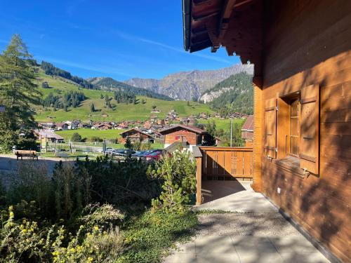 a balcony of a house with a view of a mountain at Ferienwohnungen Hotel Alpina in Adelboden