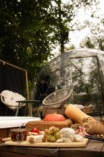 a table topped with lots of different types of food at Dôme design by Out & Lodge in Couvin