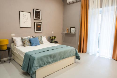 Voodi või voodid majutusasutuse a jump in Montesanto by Montesanto Luxury Domus toas