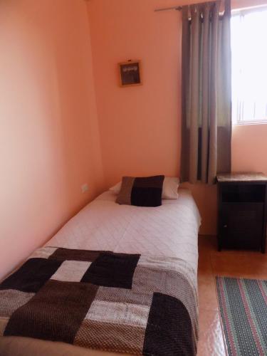 Una cama o camas en una habitación de Tambo Norte
