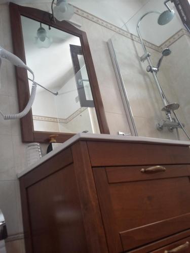 a bathroom with a sink and a mirror at B&B Itufi in Colonnella