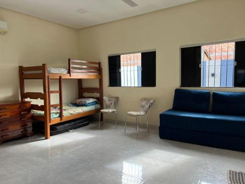 En eller flere senge i et værelse på Casa de Férias com Piscina