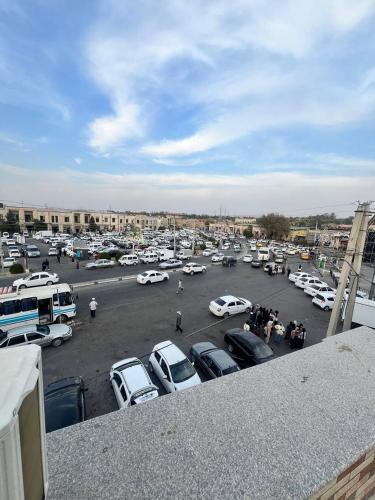 a parking lot full of cars in a parking lot at Old Saroy Hotel in Samarkand