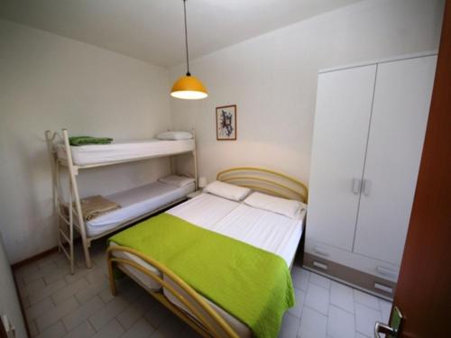 Postel nebo postele na pokoji v ubytování Enjoy our flat with garden in Rosolina