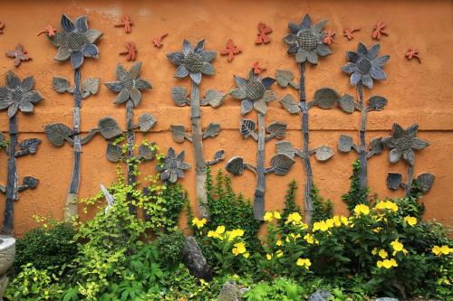 a wall with flowers and trees on it at Happiness Full Hanok Guesthouse in Jeonju