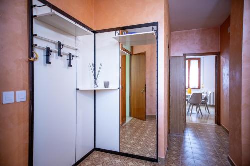 a glass door leading to a hallway with a dining room at La Corte Del Pane in Corridonia