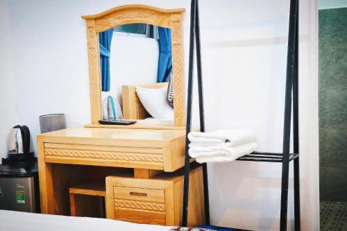 En eller flere senge i et værelse på Chau Giang Hotel