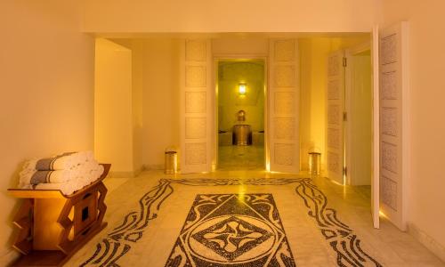 a hallway with a room with a rug on the floor at 2Ciels Boutique Hôtel in Marrakesh