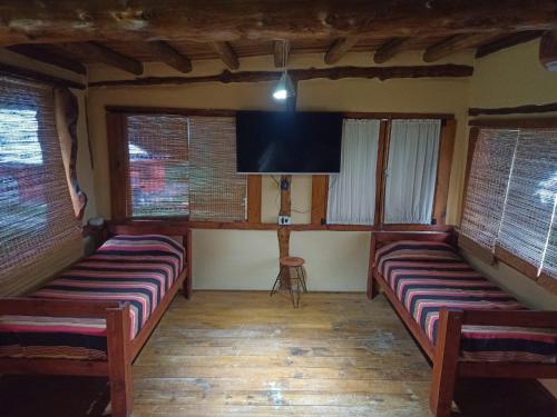 TV a/nebo společenská místnost v ubytování Rusticas