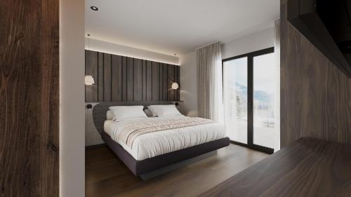 Ένα ή περισσότερα κρεβάτια σε δωμάτιο στο Suitehouse, Premium Apartments, Pools & Spa in Dolomites - by Familiaris