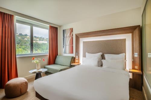 Ένα ή περισσότερα κρεβάτια σε δωμάτιο στο Novotel Lyon Centre-Confluence Bord de Saone