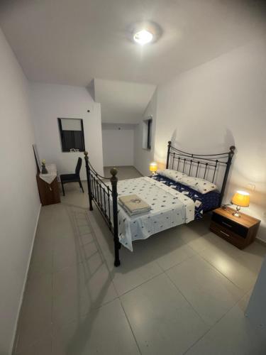 a bedroom with a bed and a desk and a chair at Room cozy in San Julian 4 in St Julian's