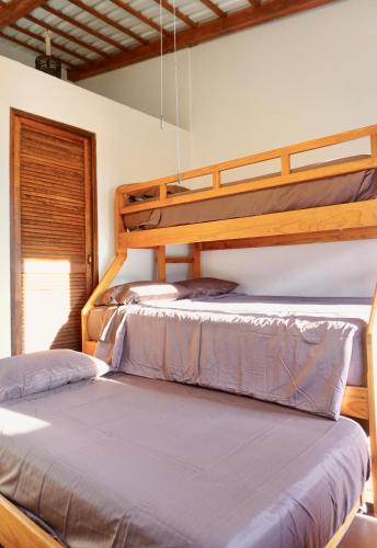 two bunk beds in a room with a window at Mini Lofts Ajijic in Ajijic