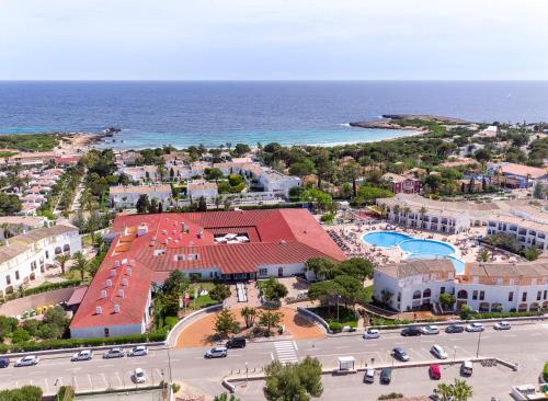 an aerial view of a resort next to the ocean at Sol Falco Menorca in Son Xoriguer