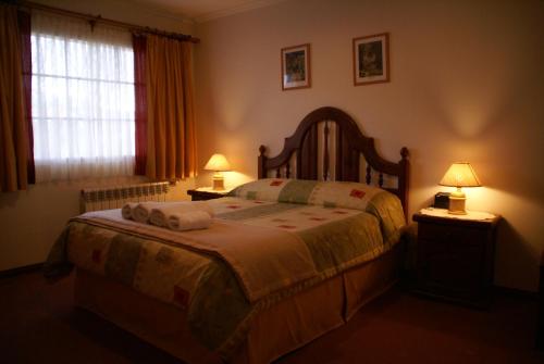 Ένα ή περισσότερα κρεβάτια σε δωμάτιο στο Hotel Las Piedras de Patagonia