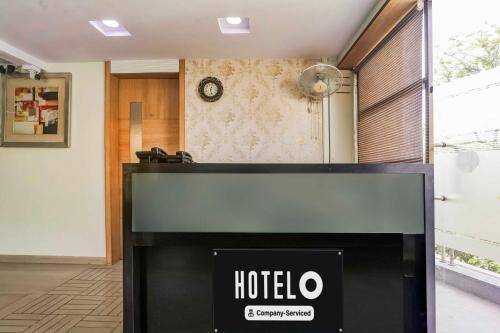 a hotel sign in front of a room at Hotel O Kranti Square Aurangabad in Aurangabad