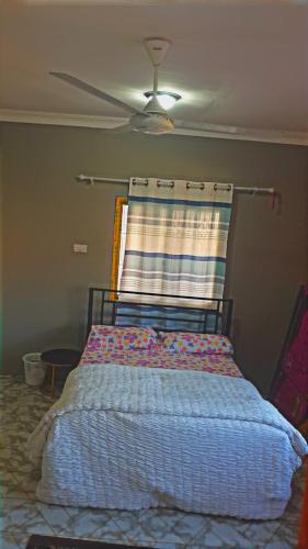 Ένα ή περισσότερα κρεβάτια σε δωμάτιο στο Michenzani Bliss