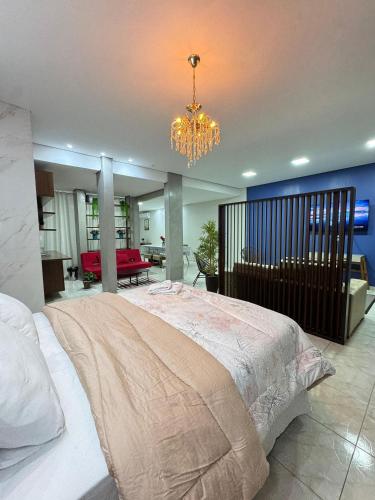 Una cama o camas en una habitación de Loft Estilo seguro e bem localizado
