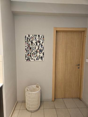 a room with a door and a picture on the wall at Beachfront Amazing New Apartment in Limassol
