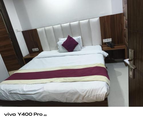 Ένα ή περισσότερα κρεβάτια σε δωμάτιο στο Family Hotel Shiva