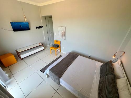 Una cama o camas en una habitación de Bertholi Beira-Mar