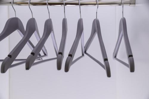 a bunch of knives hanging from a rack at Piano Tre in Verona
