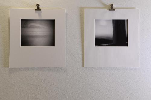 three photographs are hanging on a wall at Piano Tre in Verona